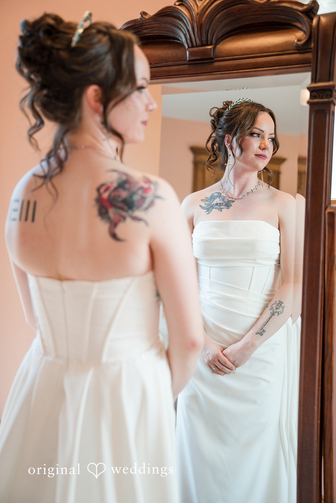 Hannah + Kyle Lovely picture of bride in front of mirror.