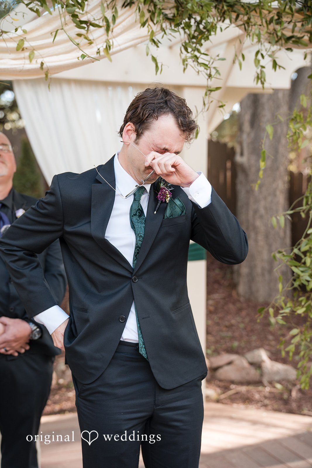 Hannah + Kyle Emotional picture of groom at the altar.