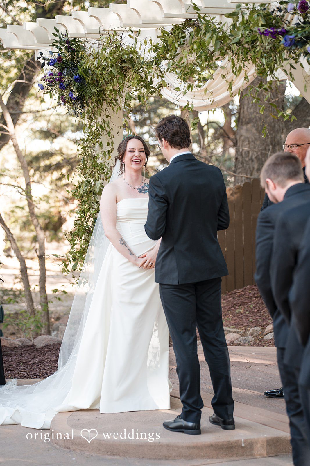 Hannah + Kyle Couple exchanging vows during the ceremony at Tapestry House c