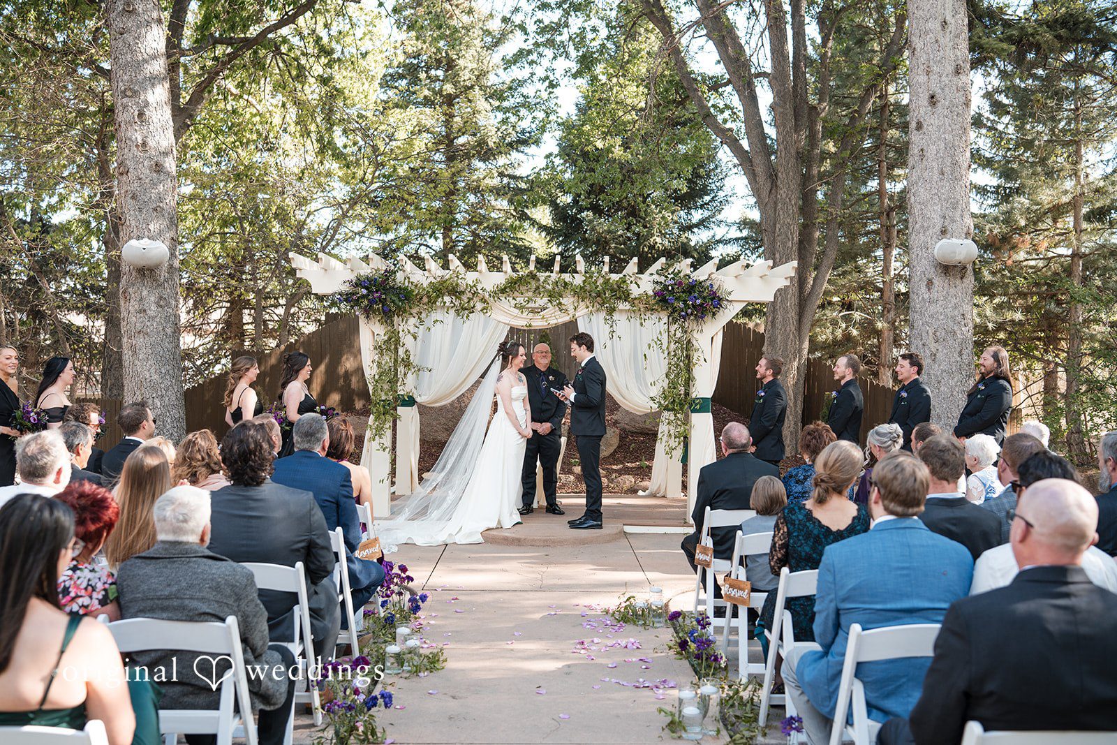 Hannah + Kyle Couple exchanging vows during the ceremony at Tapestry House captured by Denver wedding photographers from Original Weddings