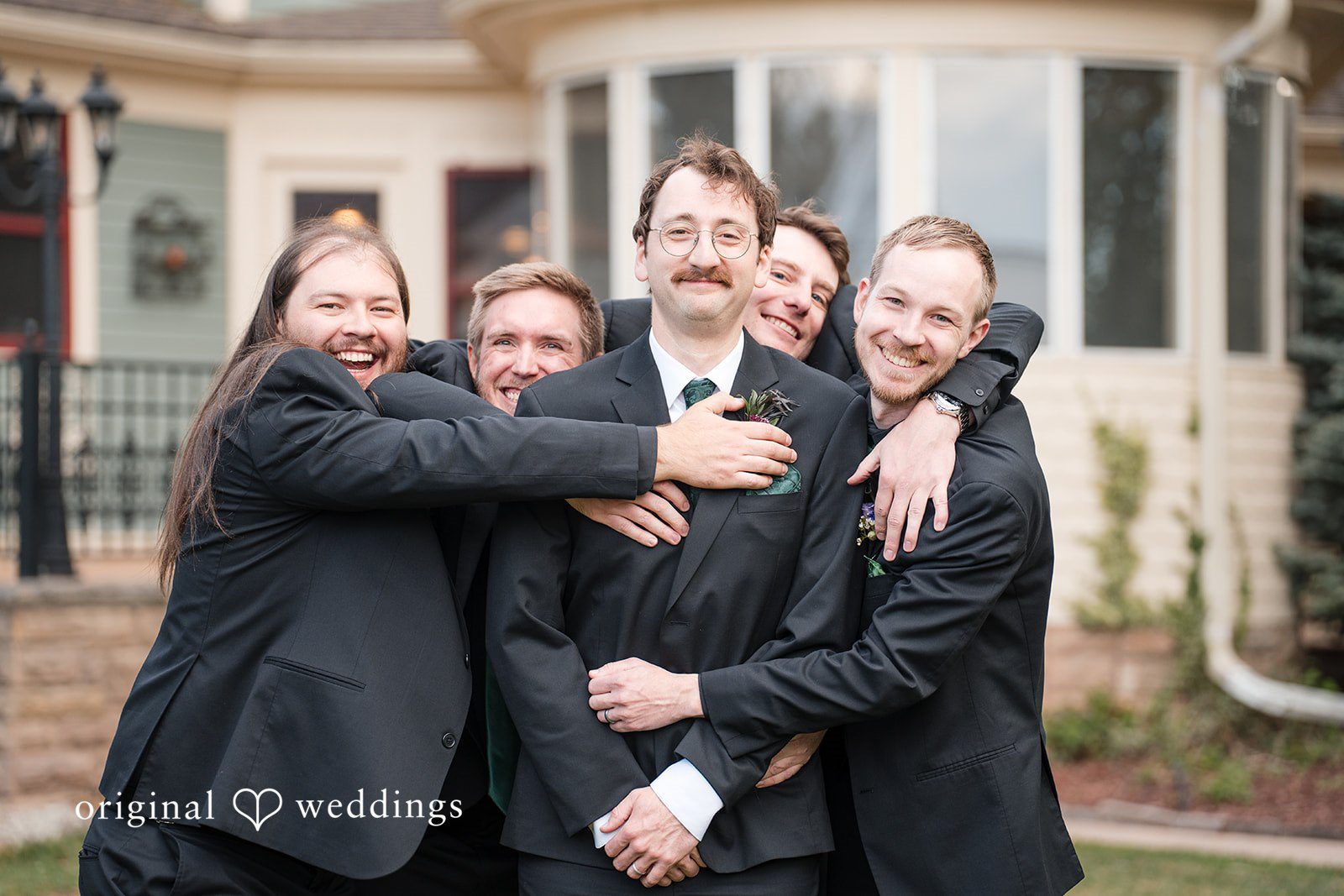 Hannah + Kyle Group shot of groom with groomsmen, all smiling