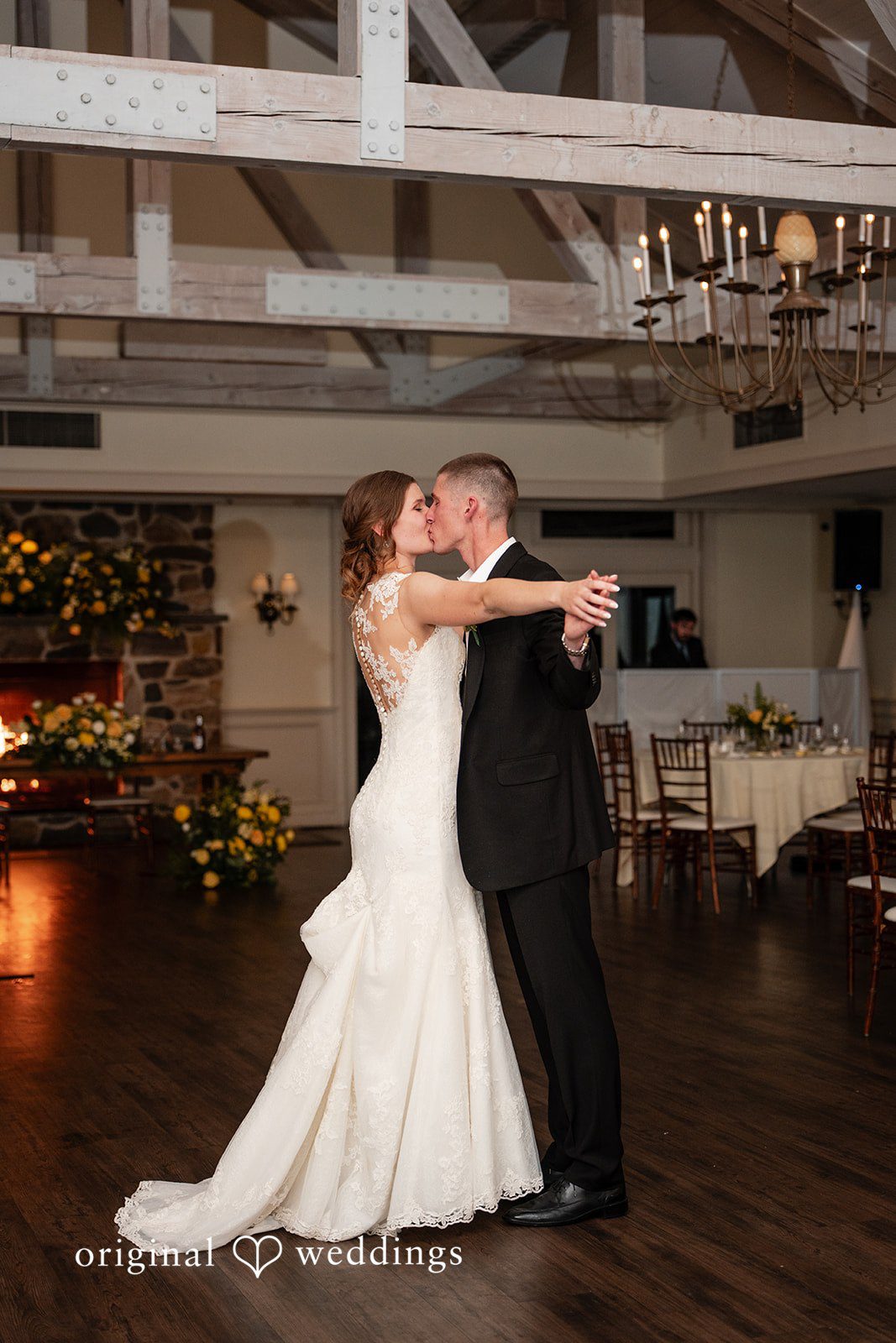 Alanna + Stan Romantic first dance portrait of newlyweds sharing a kiss.