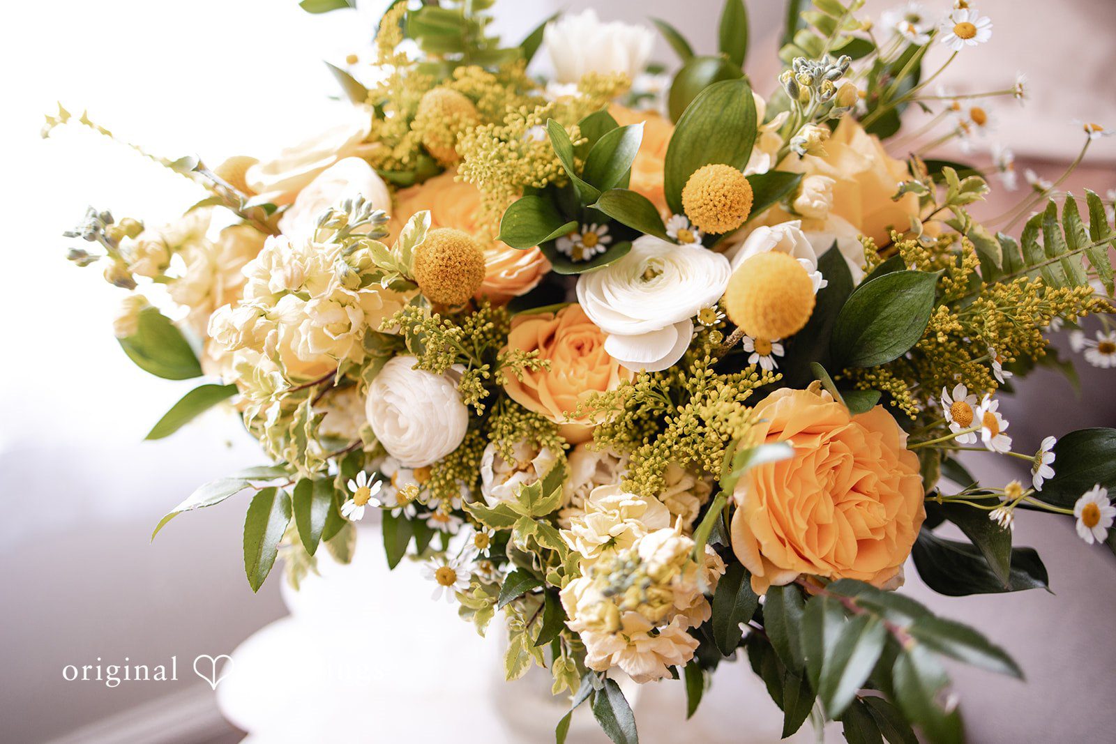 Alanna + Stan Elegant floral arrangement with fresh greenery and soft blooms