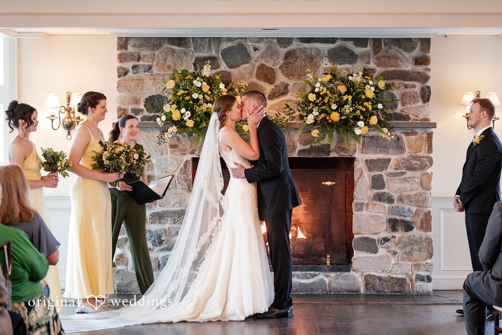 Alanna + Stan Bride and groom sharing first kiss as newlyweds