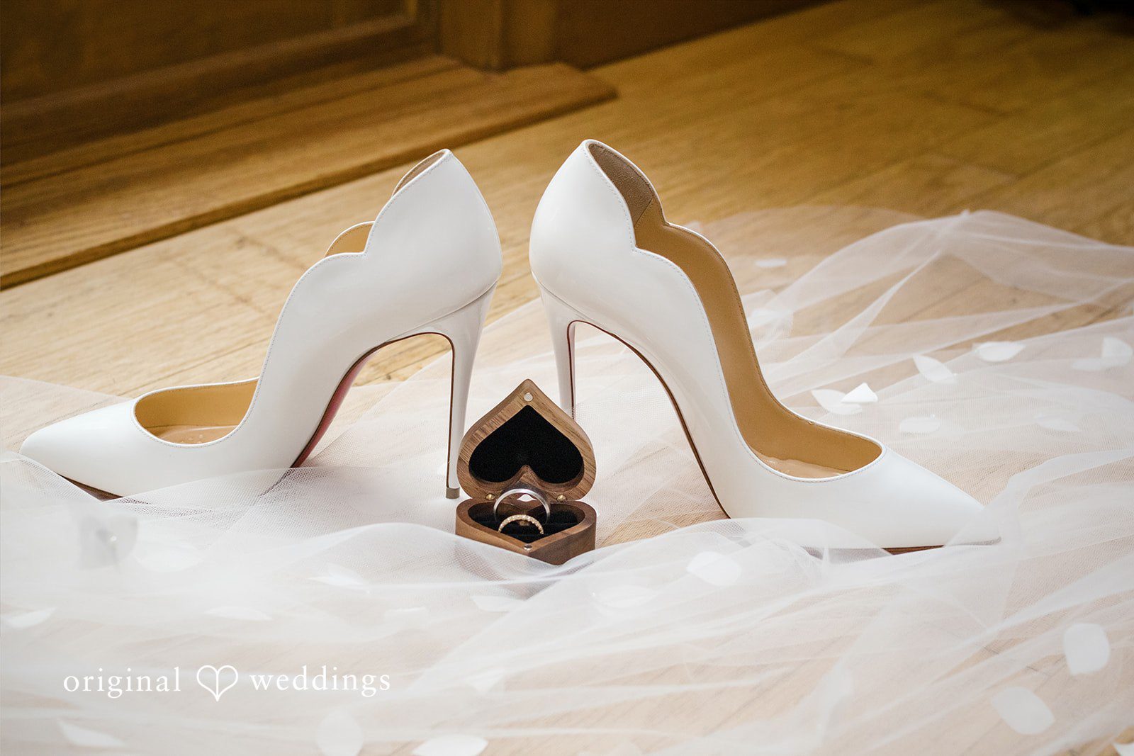 Nicole + Dalton Close up picture of wedding rings and bridal shoes