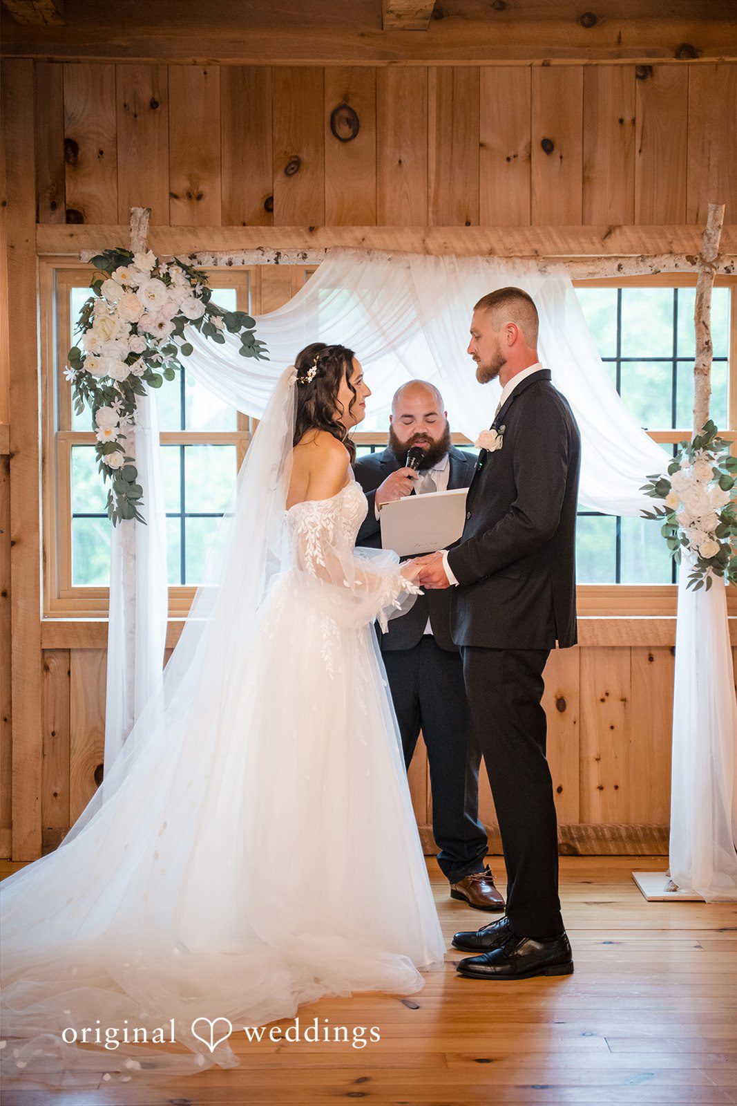 Nicole + Dalton Couple exchanging vows during wedding ceremony