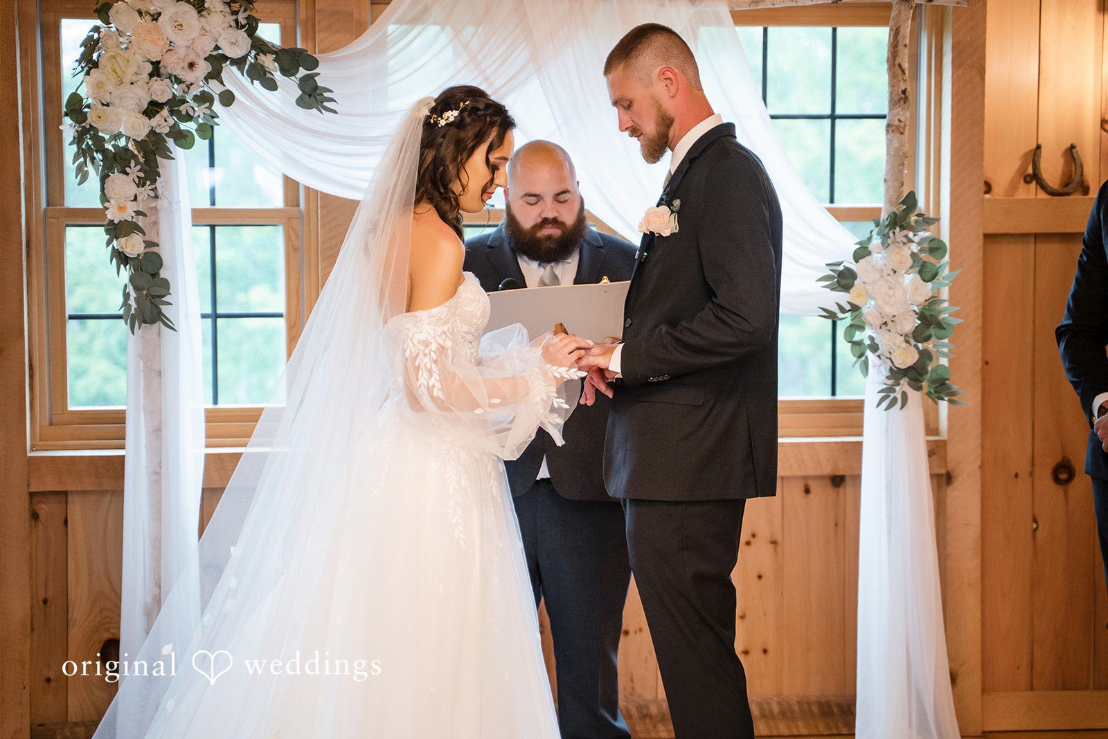 Nicole + Dalton Lovely couple exchanging the wedding rings during wedding ceremony