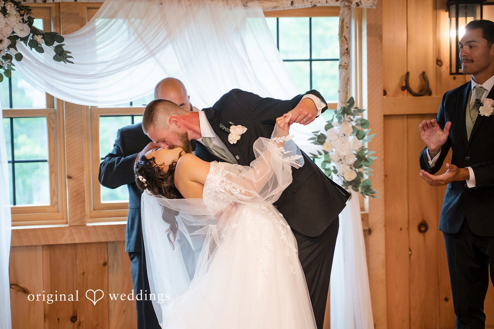 Nicole + Dalton Romantic first kiss moment of couple during wedding ceremony