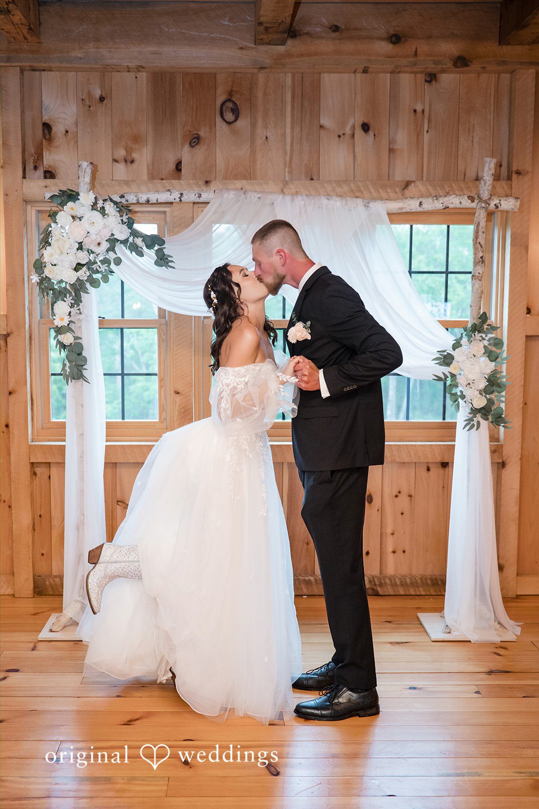Nicole + Dalton Romantic first kiss moment of couple during wedding ceremony