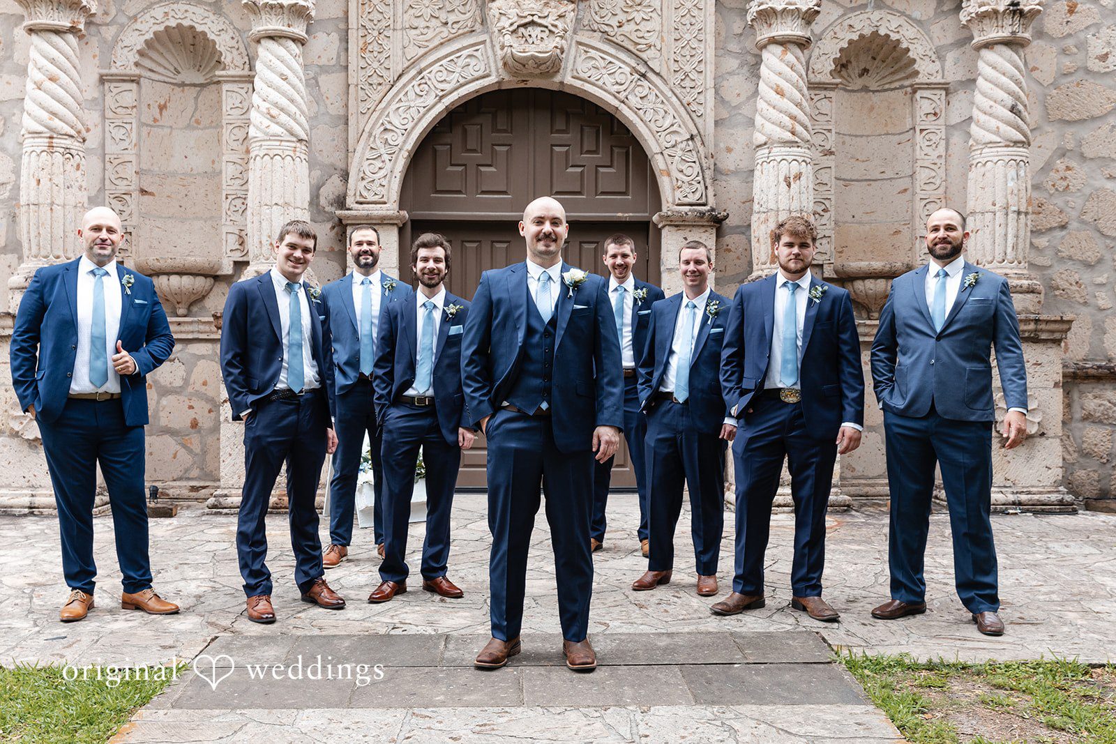 Mary Rose + Nate Groom posing with his groomsmen before the wedding