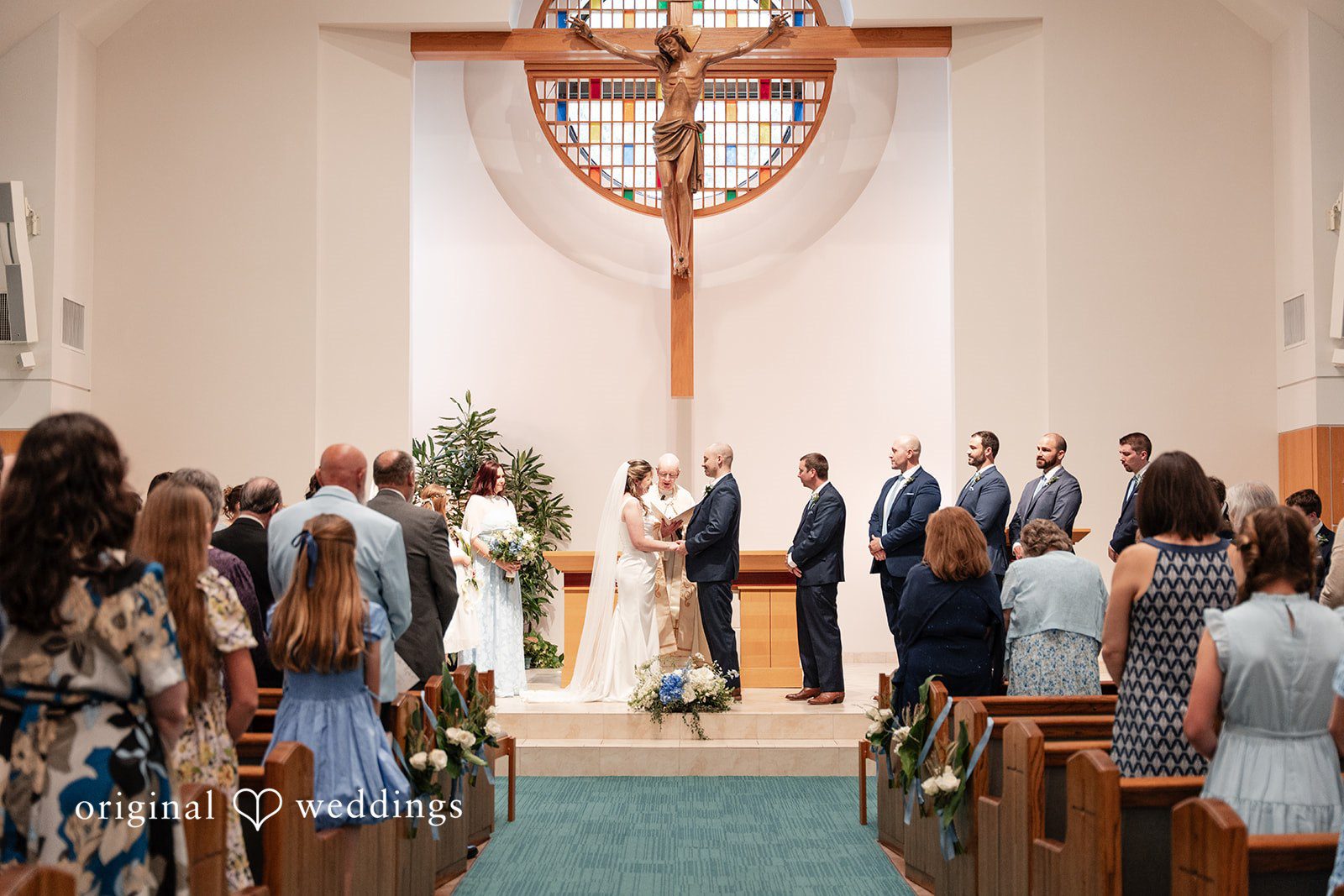 Mary Rose + Nate Wide view of the couple listening during the wedding ceremony