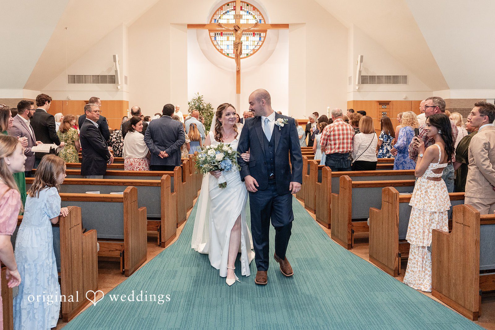 Mary Rose + Nate Bride and groom walking down the aisle after the ceremony