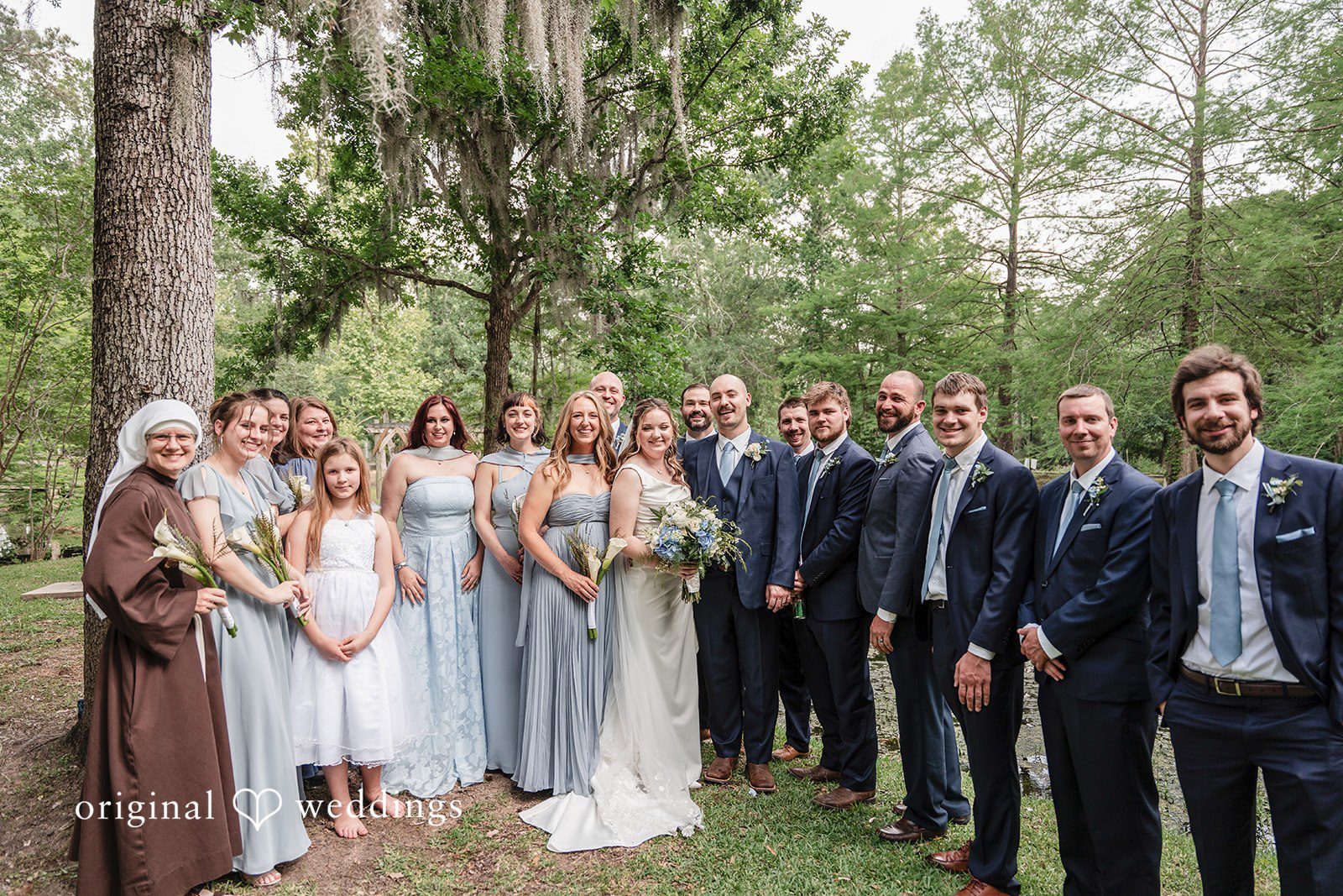 Mary Rose + Nate Bride and groom posing with their full wedding party