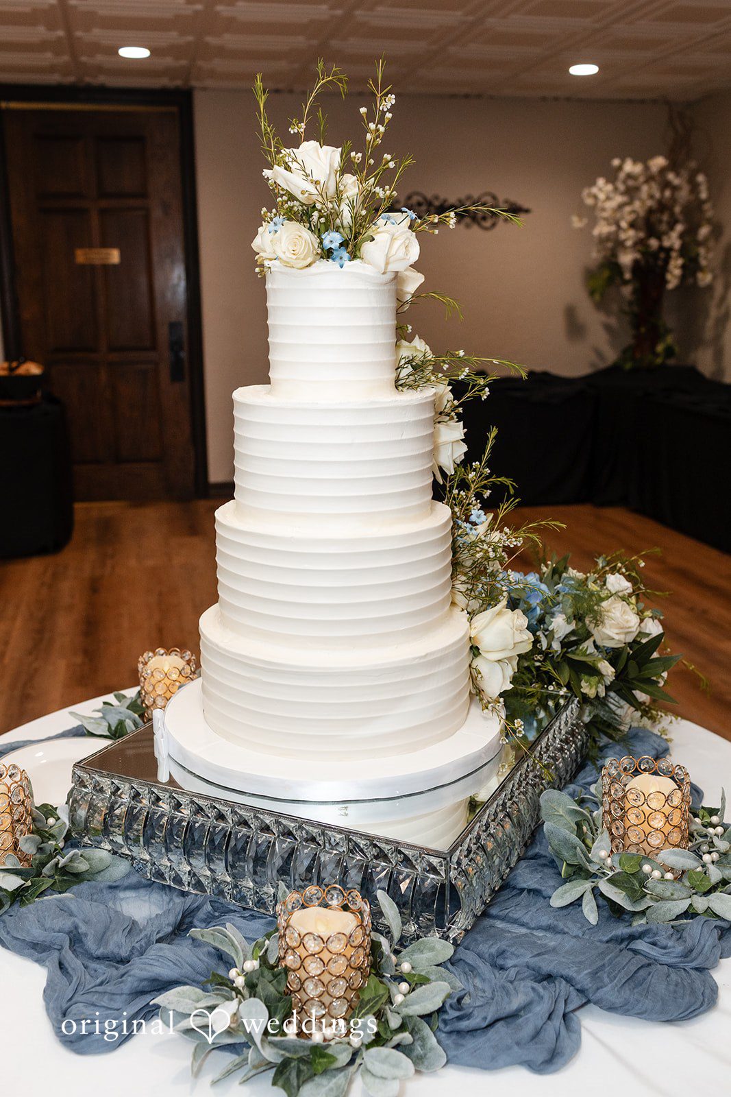 Mary Rose + Nate Detailed portrait of an elegant wedding cake at the reception