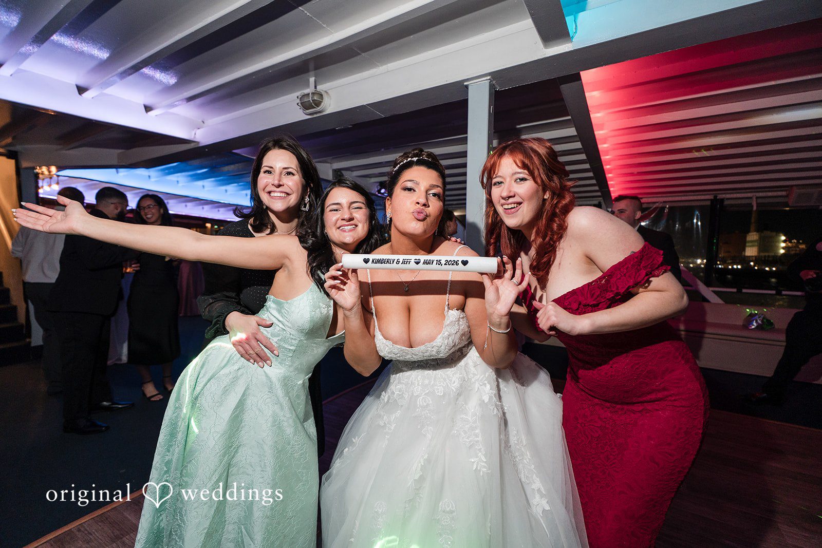 Kimberly + Jeff The bride poses with her wedding party