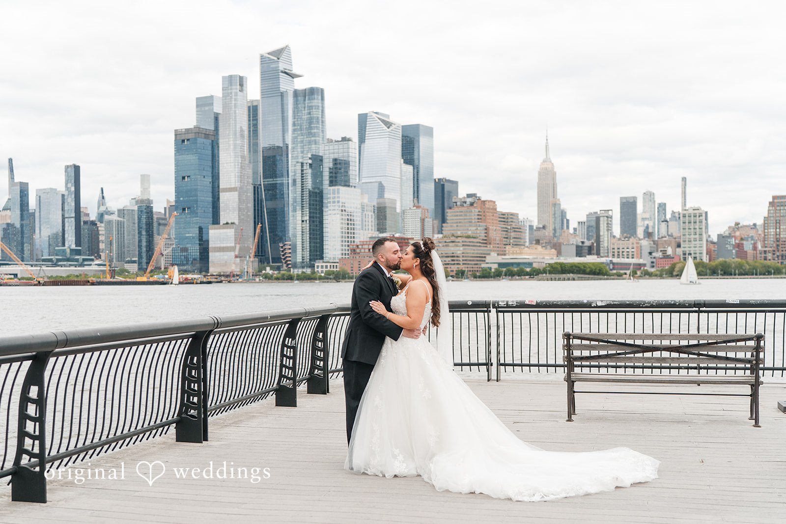 Kimberly + Jeff The couple shares a romantic kiss along the waterfront at The Destiny Yacht