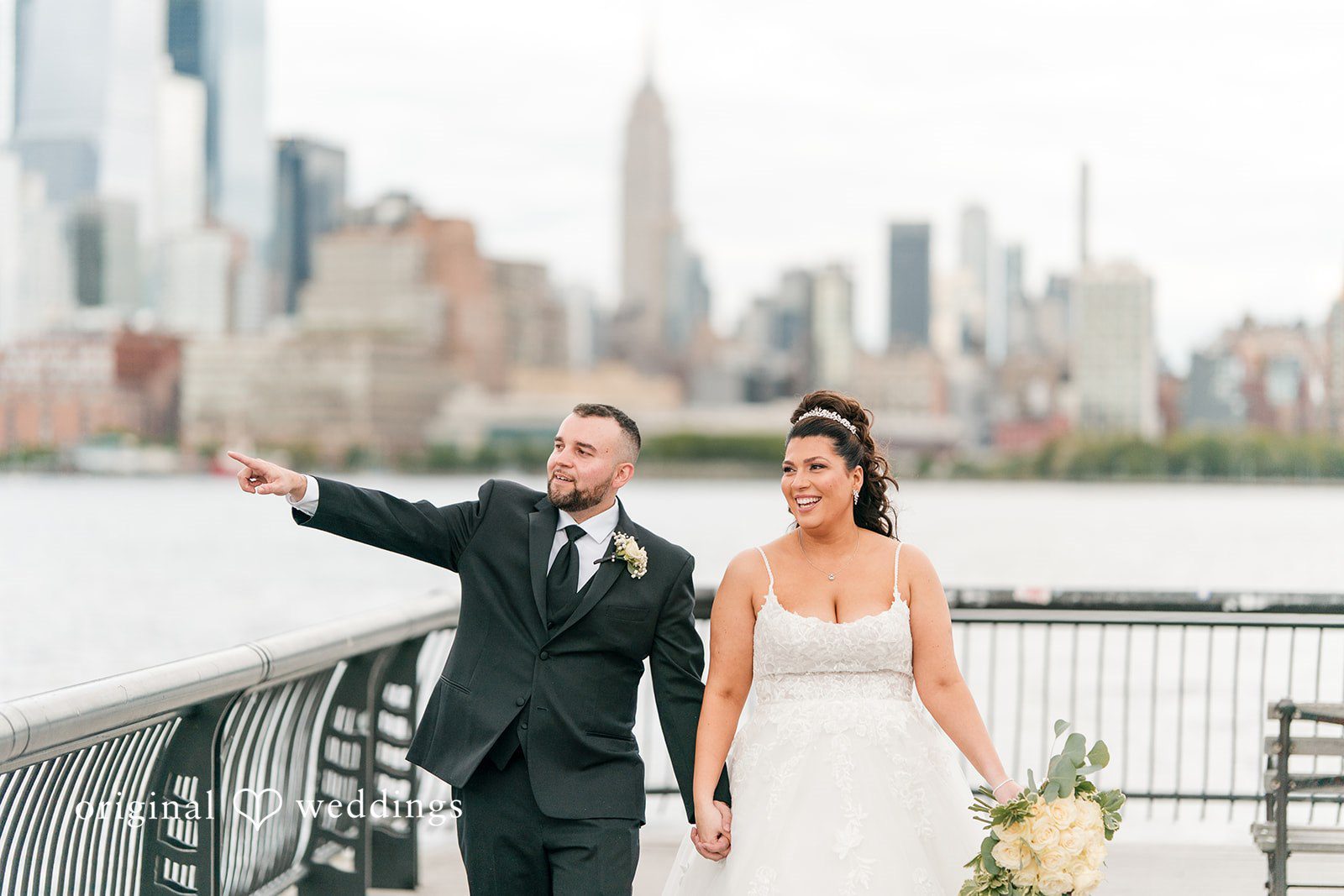 Kimberly + Jeff Our New York City wedding photographers captured a stunning portrait of the couple as they take a walk along the waterfront