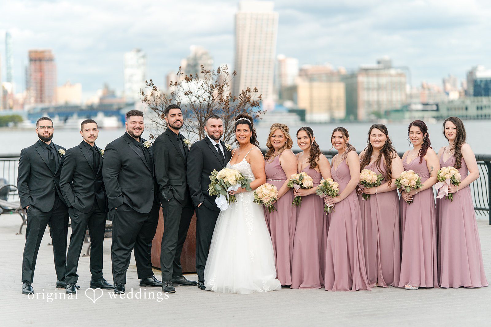 Our New York City wedding photographers at Original Weddings captured a stunning portrait of the couple and their bridal party at The Destiny Yacht