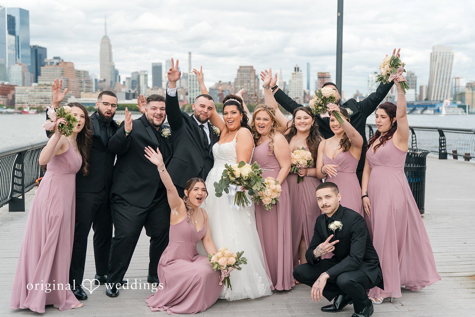 Kimberly + Jeff A joyful portrait of the couple and their bridal party at The Destiny Yacht