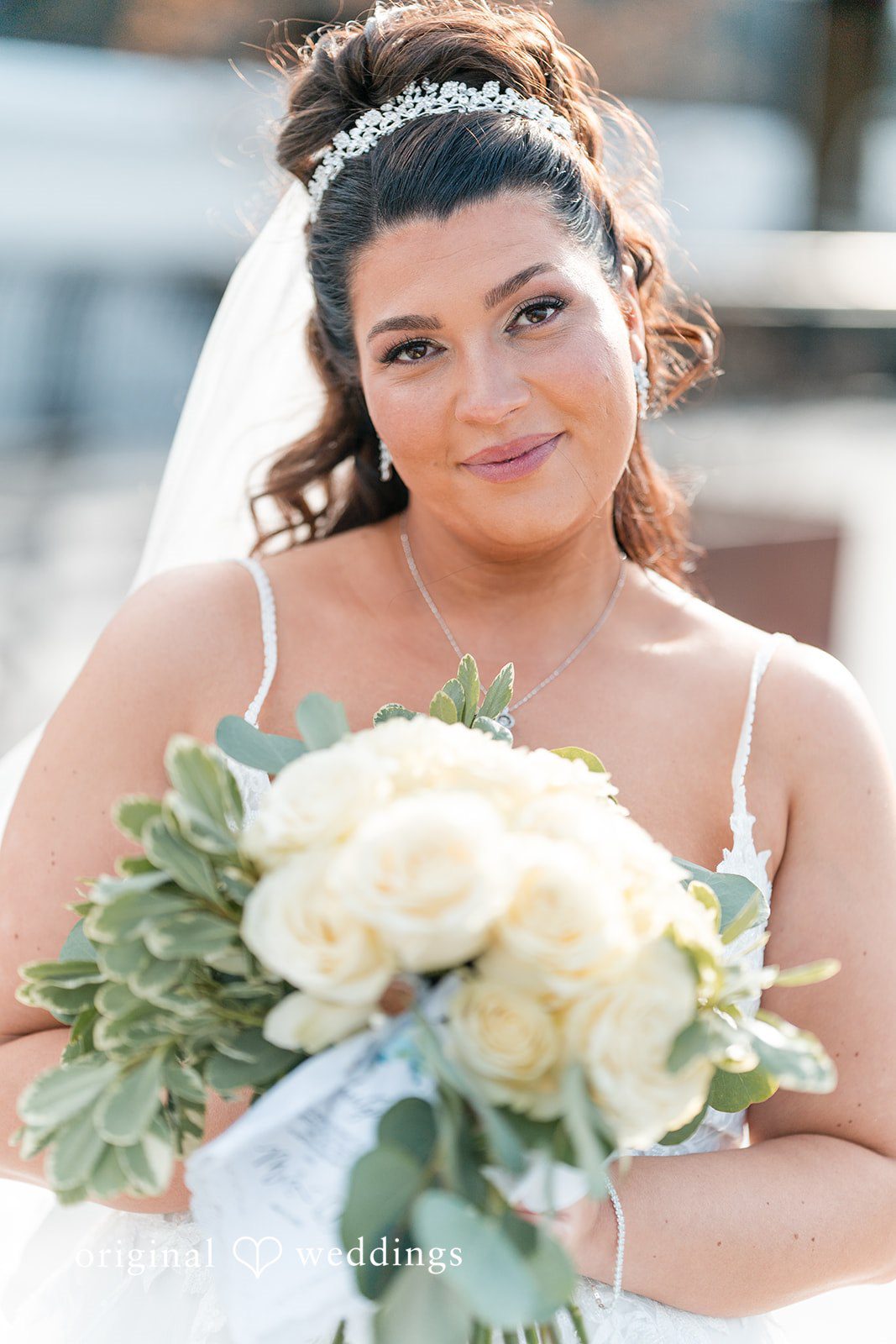 Kimberly + Jeff A stunning portrait of the bride carrying her huge bouquet