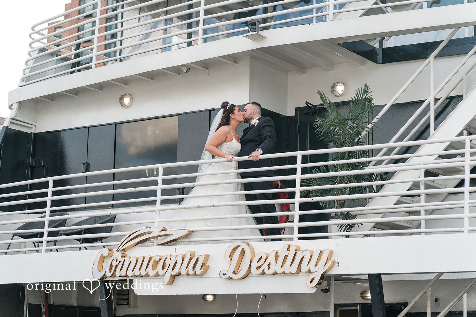 Kimberly + Jeff The couple takes a romantic kiss on the yacht