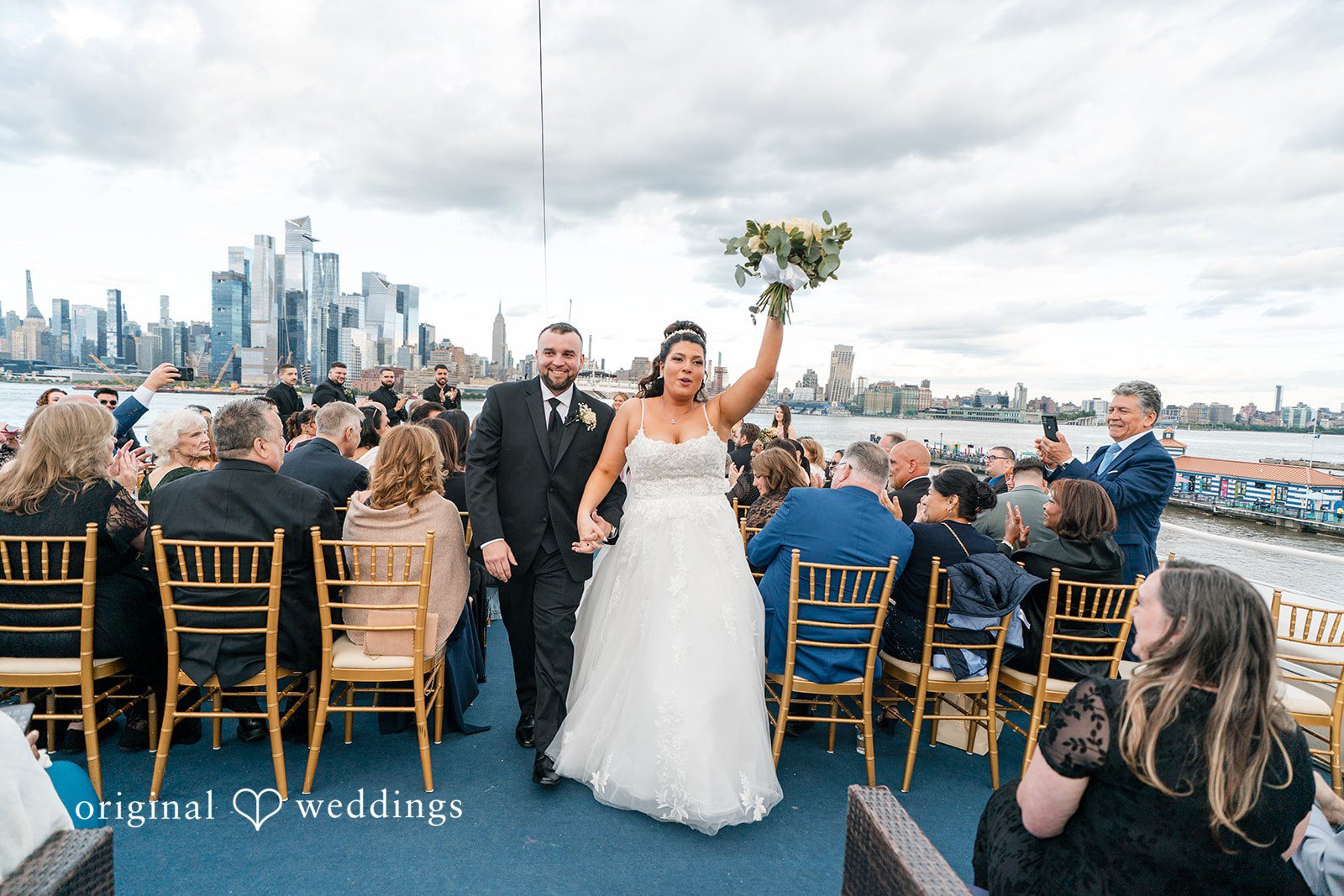 Kimberly + Jeff Our New York City wedding photographers captured the moment the couple made a joyful exit after their wedding ceremony