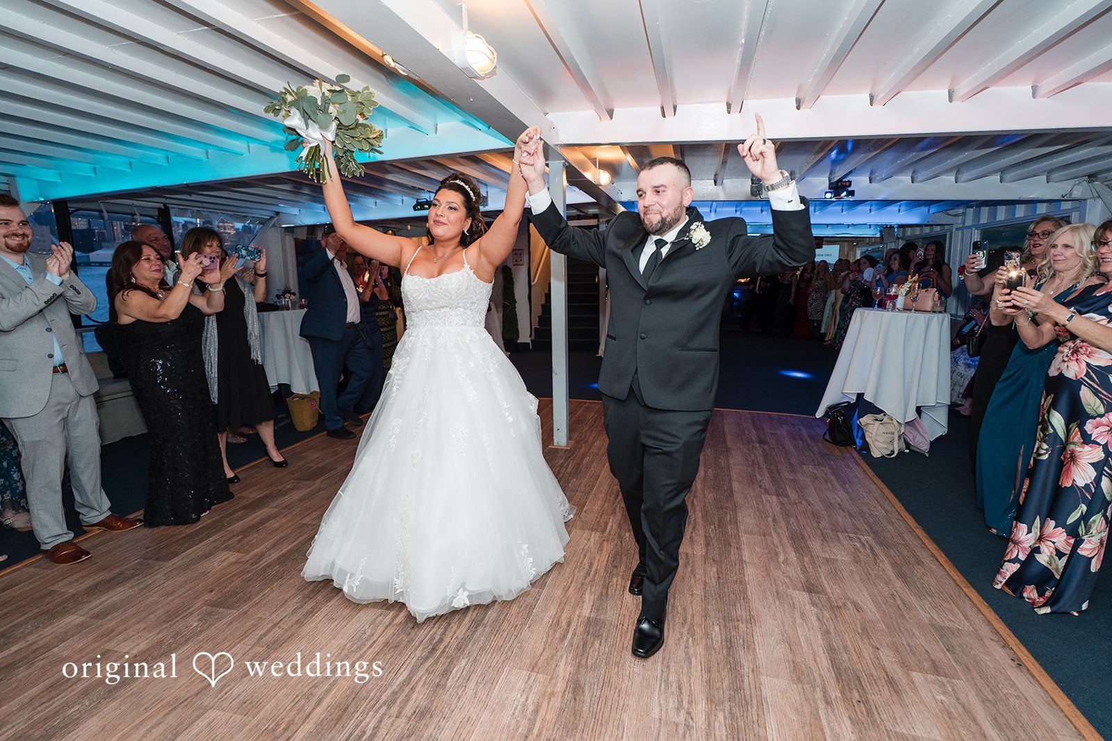 Kimberly + Jeff The couple makes a joyful entrance to their wedding reception