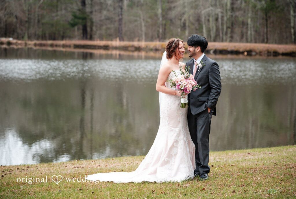 Emsley + Sean Atlanta wedding photographers by Original Weddings capturing couple smiling while looking at each other at The Farley Estate