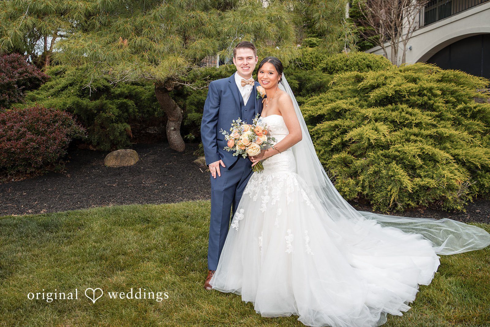 Couple portrait surrounded by greenery at The Manor House at Commonwealth during their joyful garden party wedding