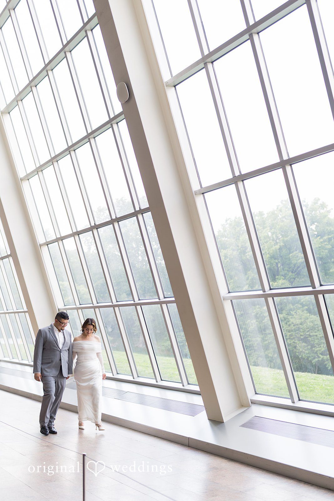 The couple takes a walk through the spectacular glass window corridor