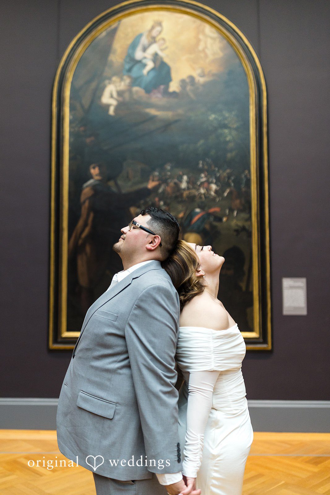 The couple strikes a stylish pose