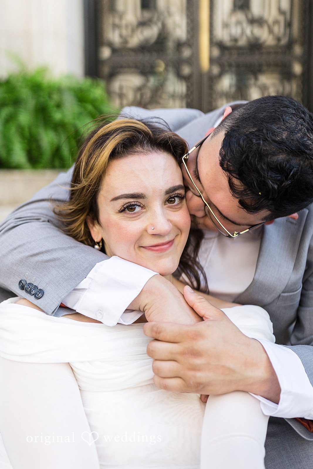 The groom pecks the bride