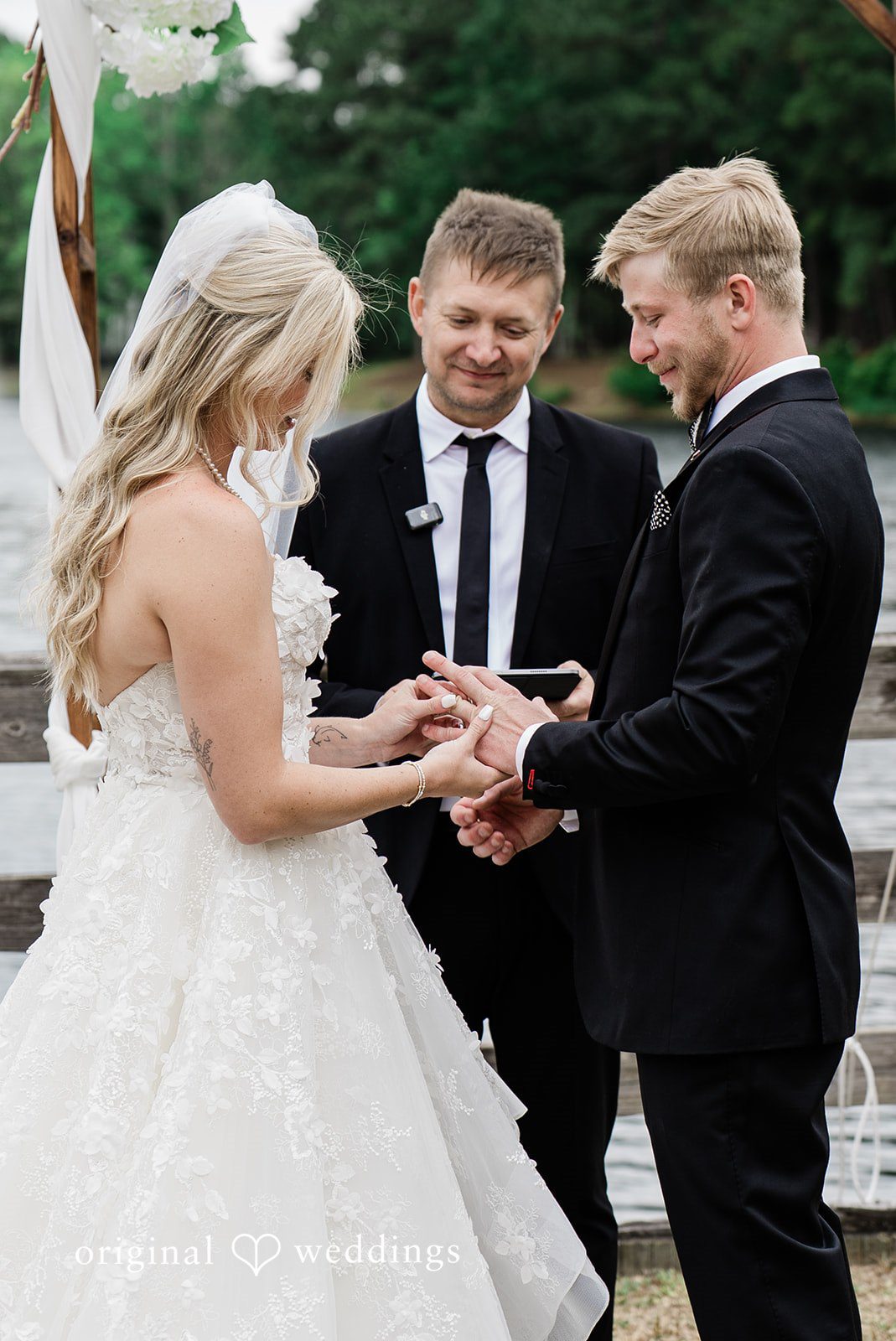 Madeline + John Bride and groom holding hands during the ceremony