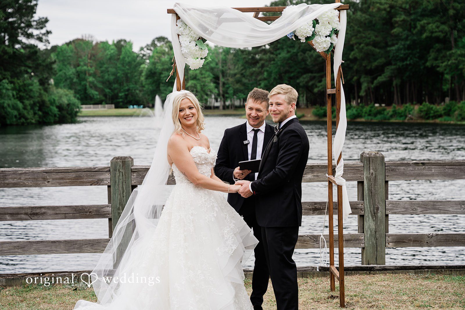 Madeline + John Newlyweds embracing after exchanging vows