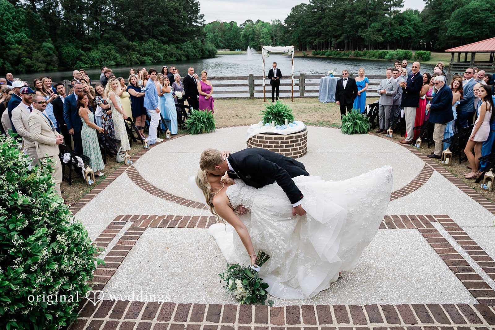 Madeline + John Bride and groom sharing their first kiss after the ceremony