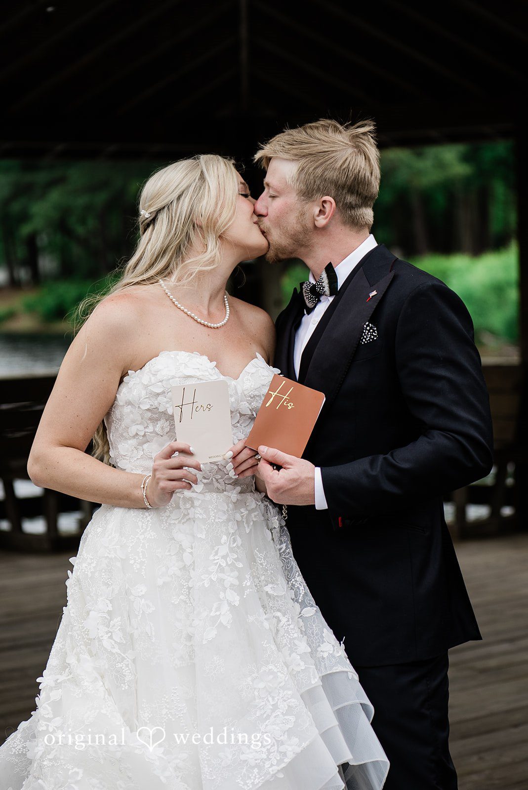 Madeline + John Newlyweds sharing a kiss during the ceremony celebration