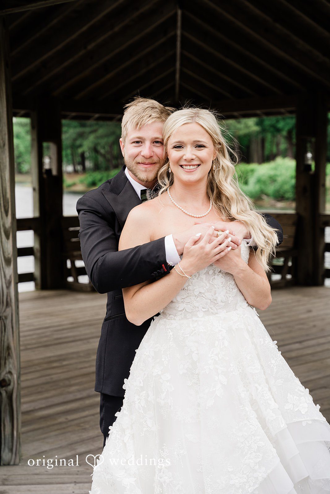 Madeline + John Bride and groom portrait on the lakeside dock