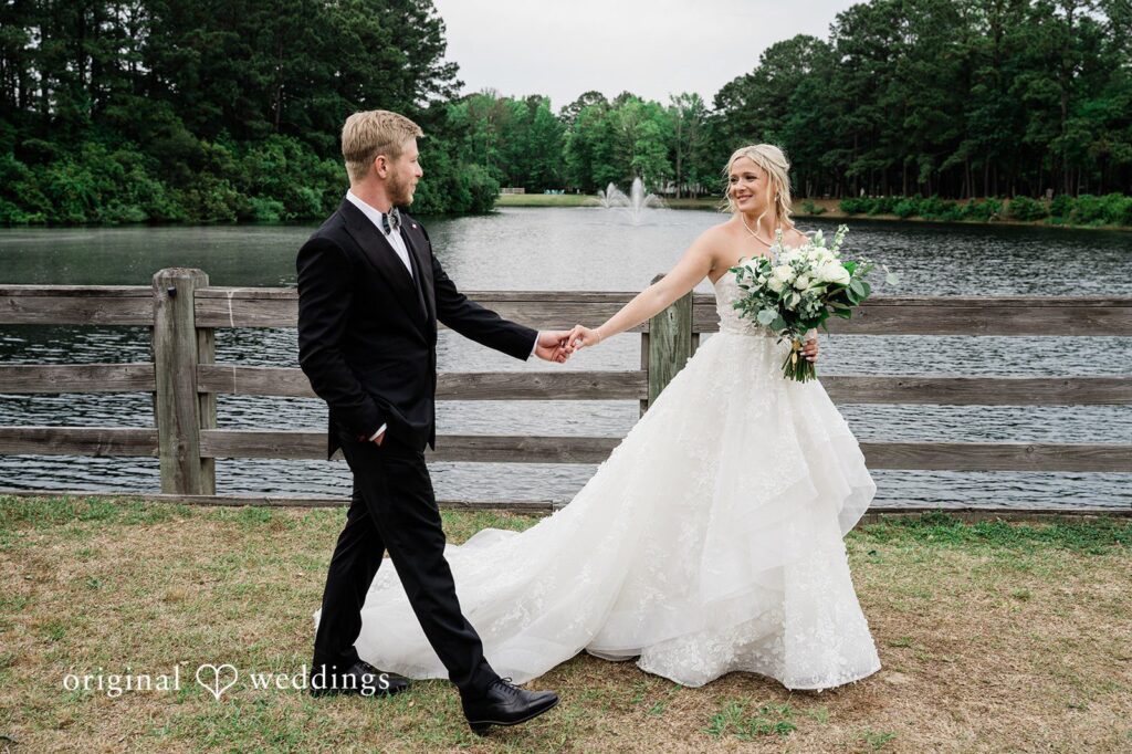 Madeline + John Bride and groom walking together along the lake