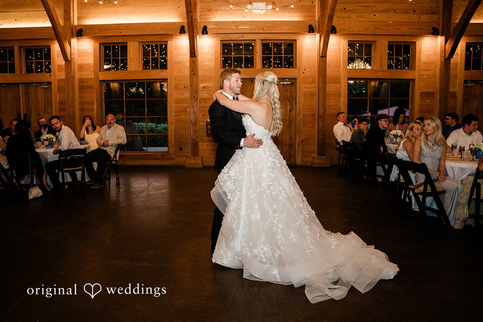 Madeline + John Bride and groom sharing their first dance at the reception