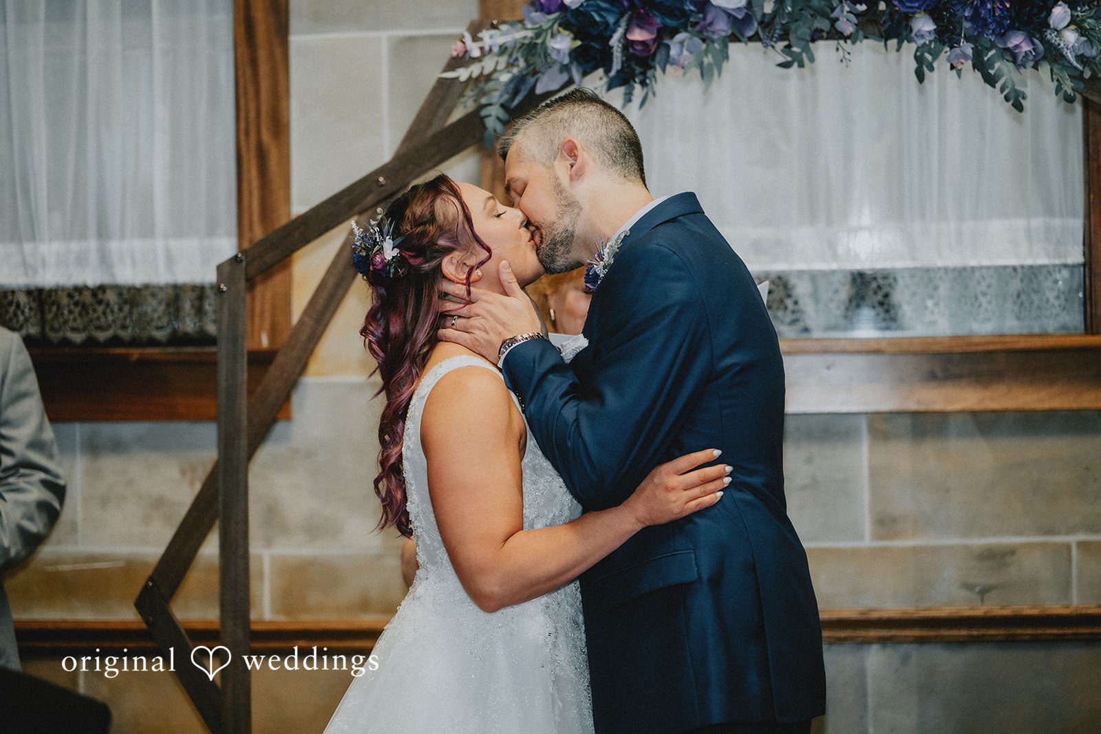 The couple takes their first kiss