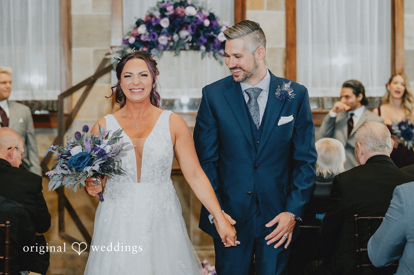 Our Hartford CT wedding photographers at Original Weddings captured the moment the couple made a joyful exit after their wedding ceremony at The Society Room of Hartford