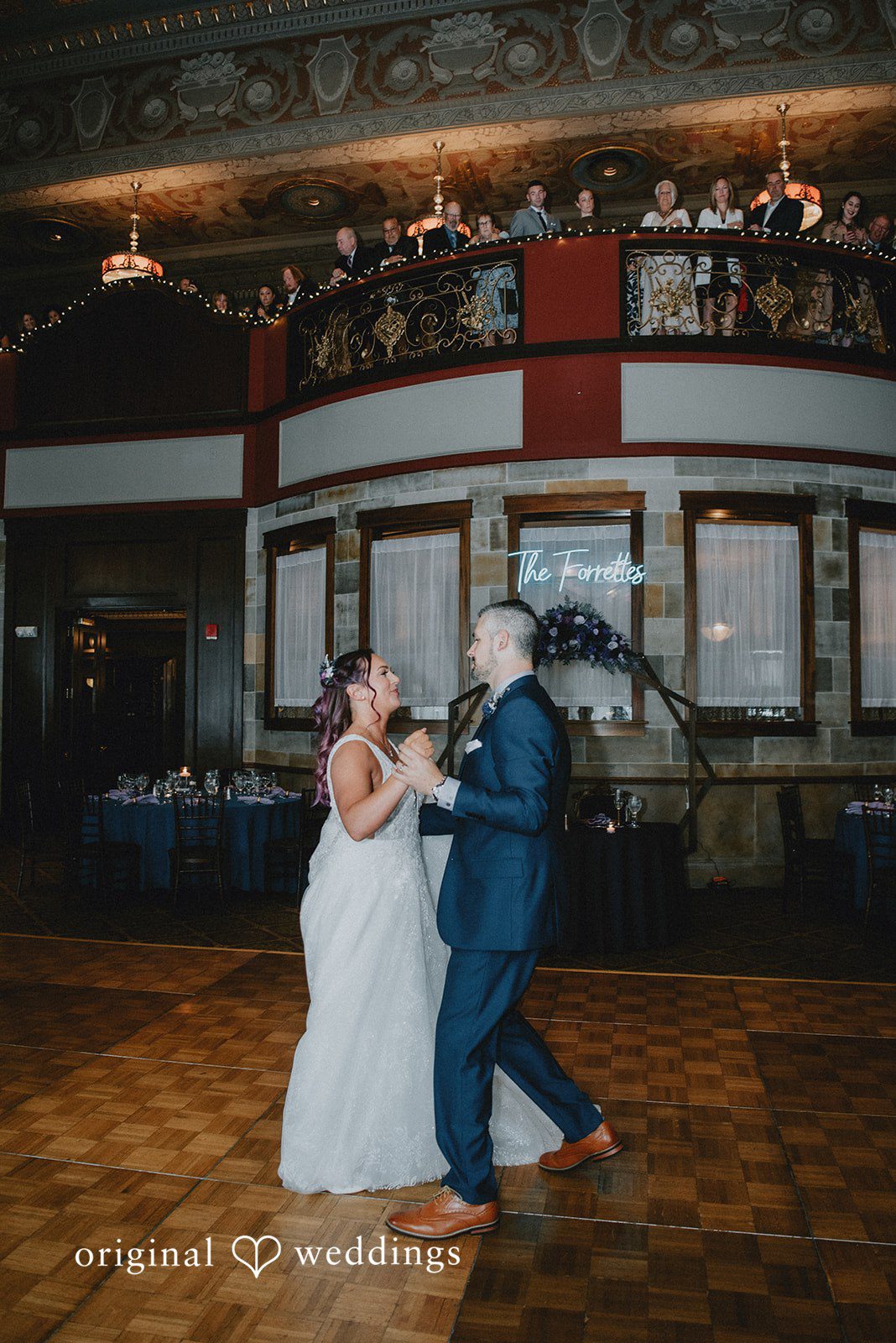 The couple takes their first dance