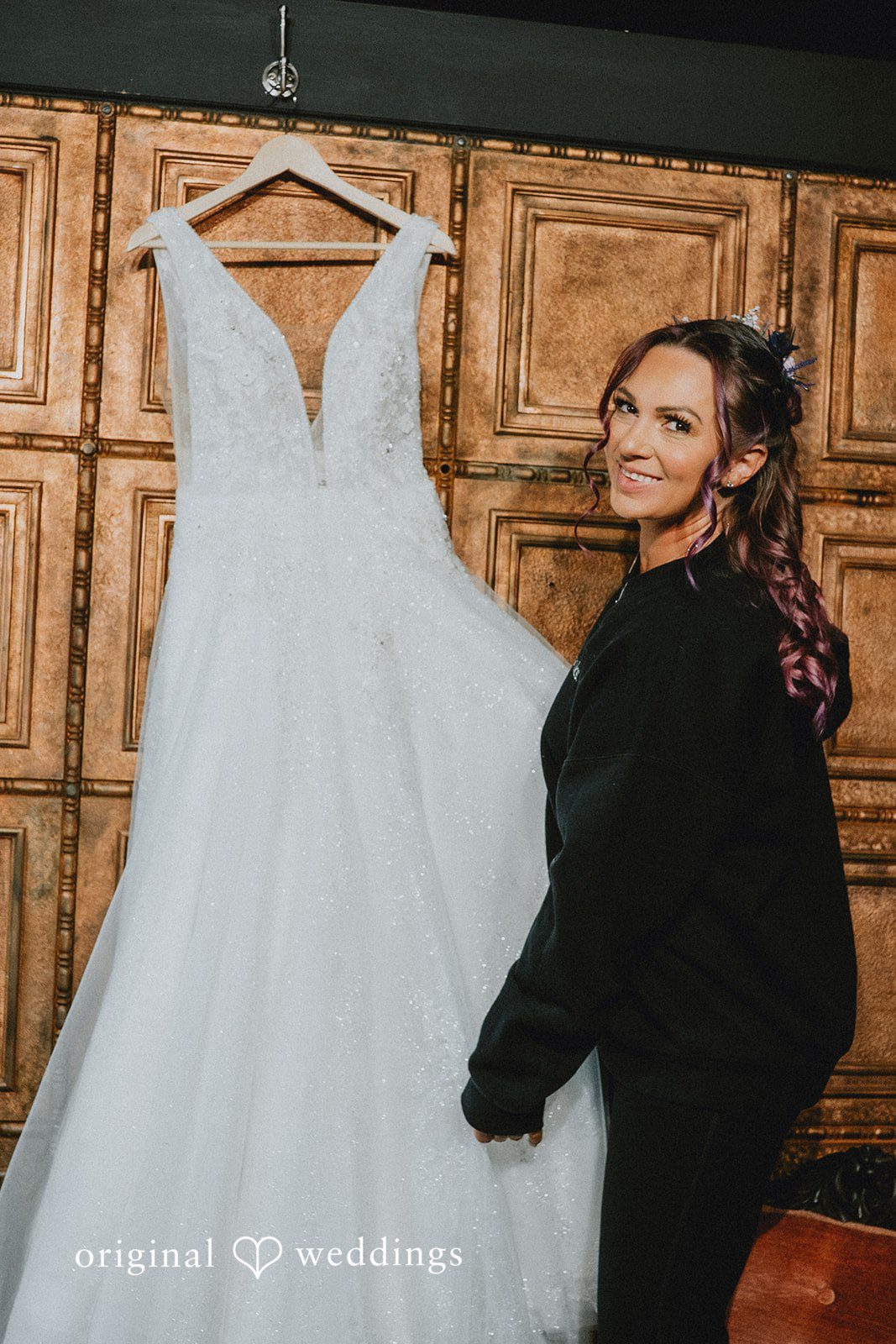The bride checks out her gown
