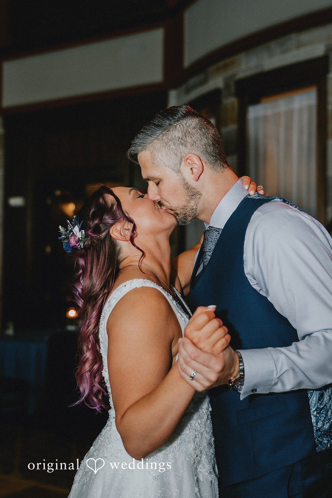 The couple shares a kiss