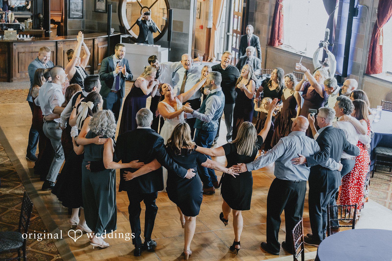 The couple shares a beautiful moment with their wedding party
