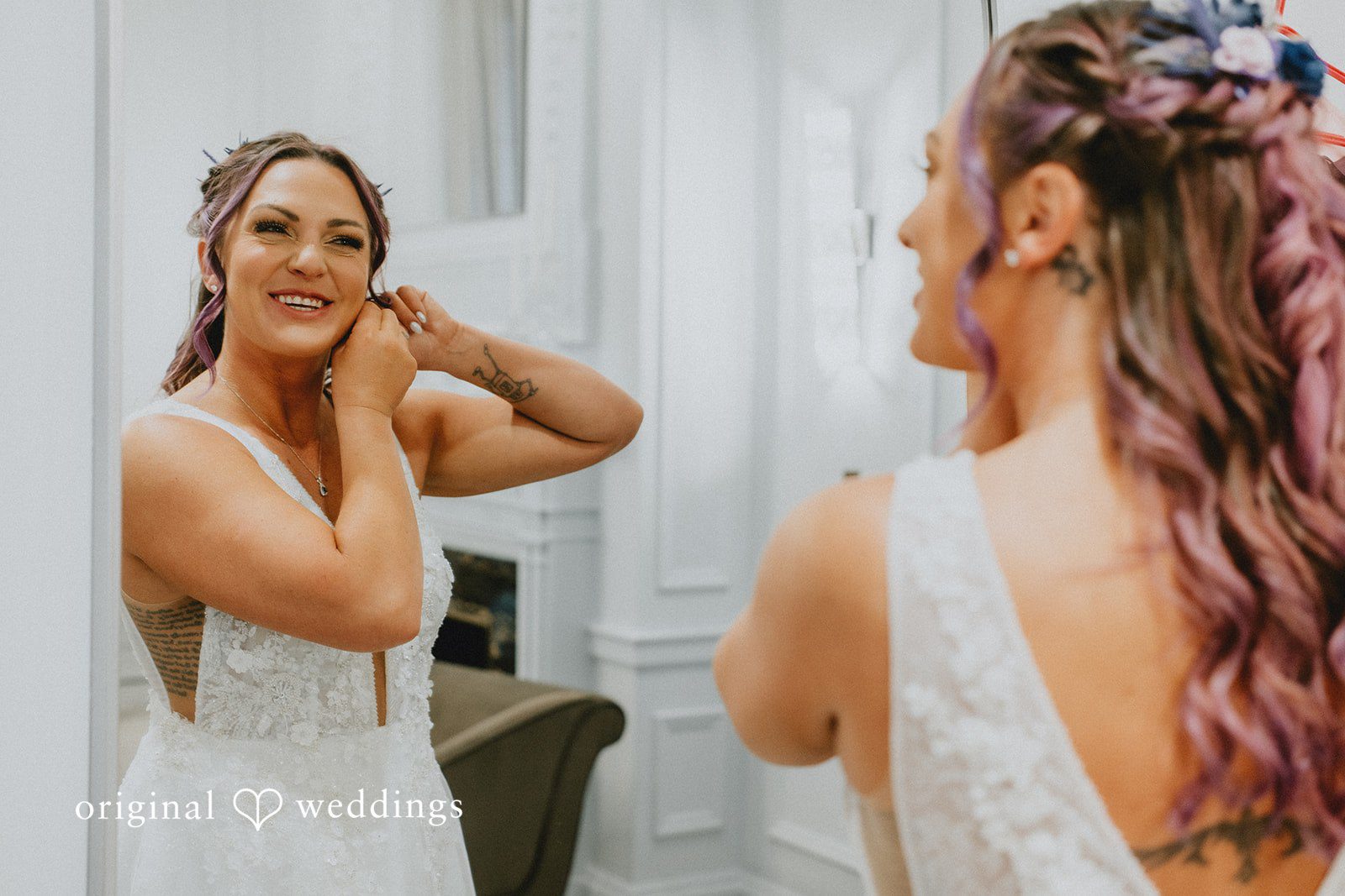 The bride wears her earrings