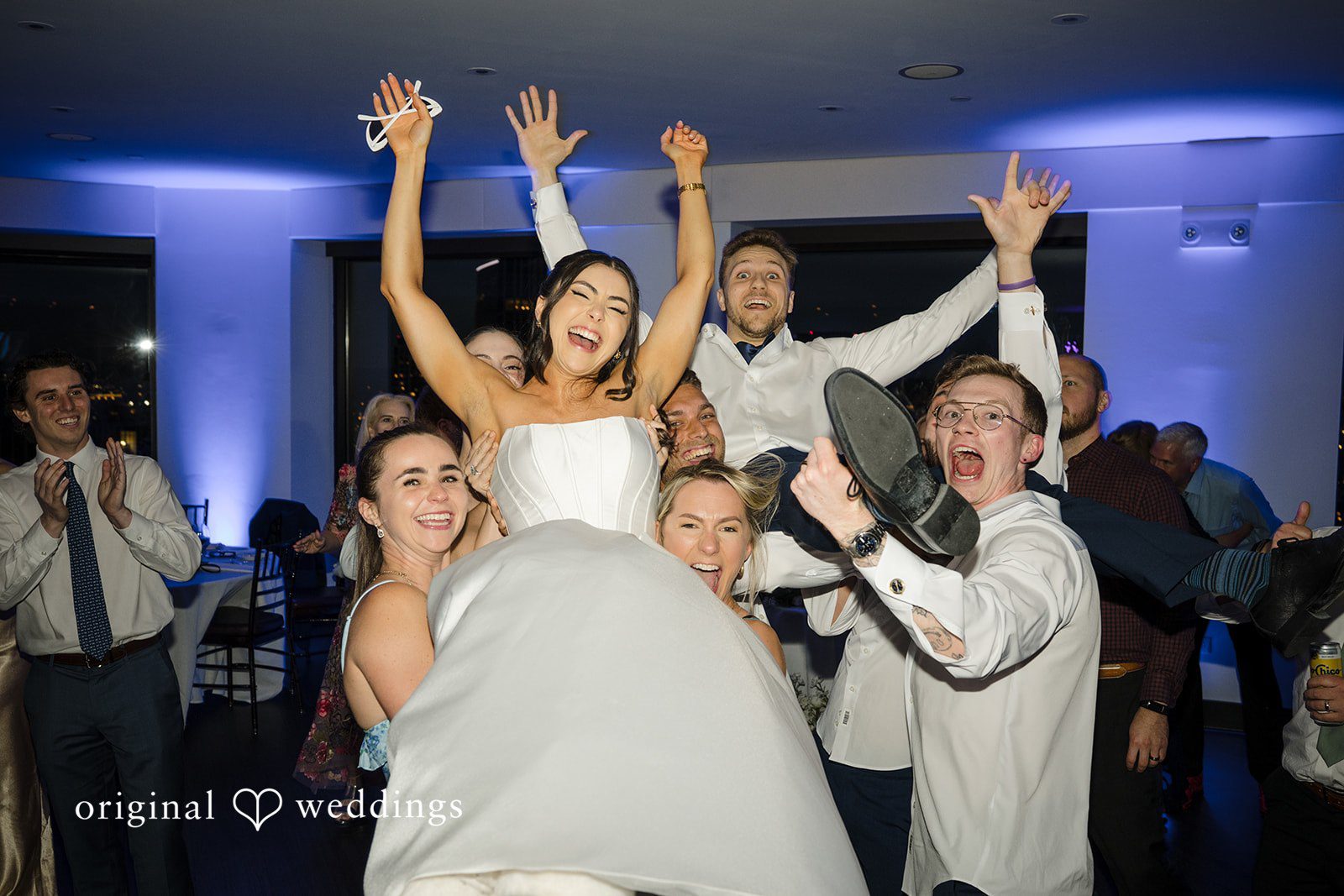 Nathan + Ainsley The bridal party joyfully lifts the bride up