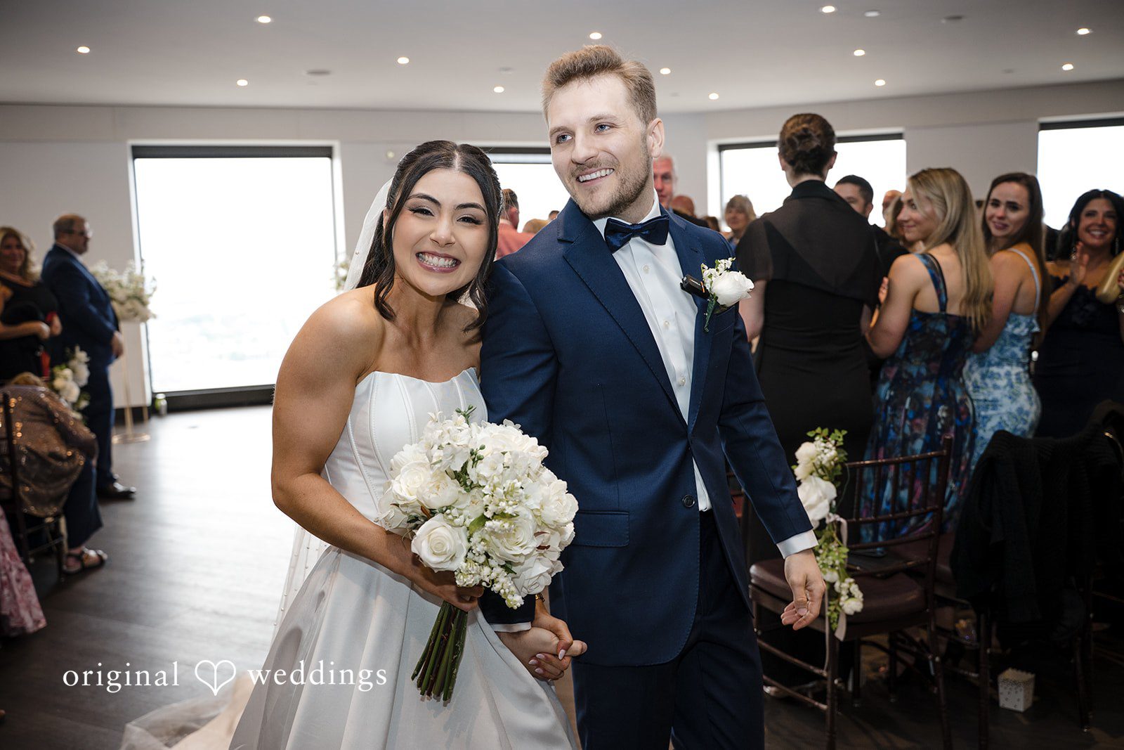 Nathan + Ainsley Our Boston wedding photographers captured the moment the couple made a joyful exit after their wedding ceremony at The State Room