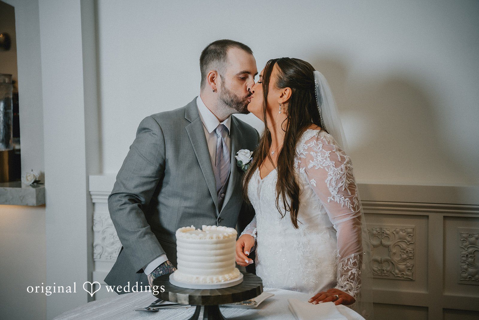 Danielle + Tyler Newlyweds cutting their wedding cake at the reception