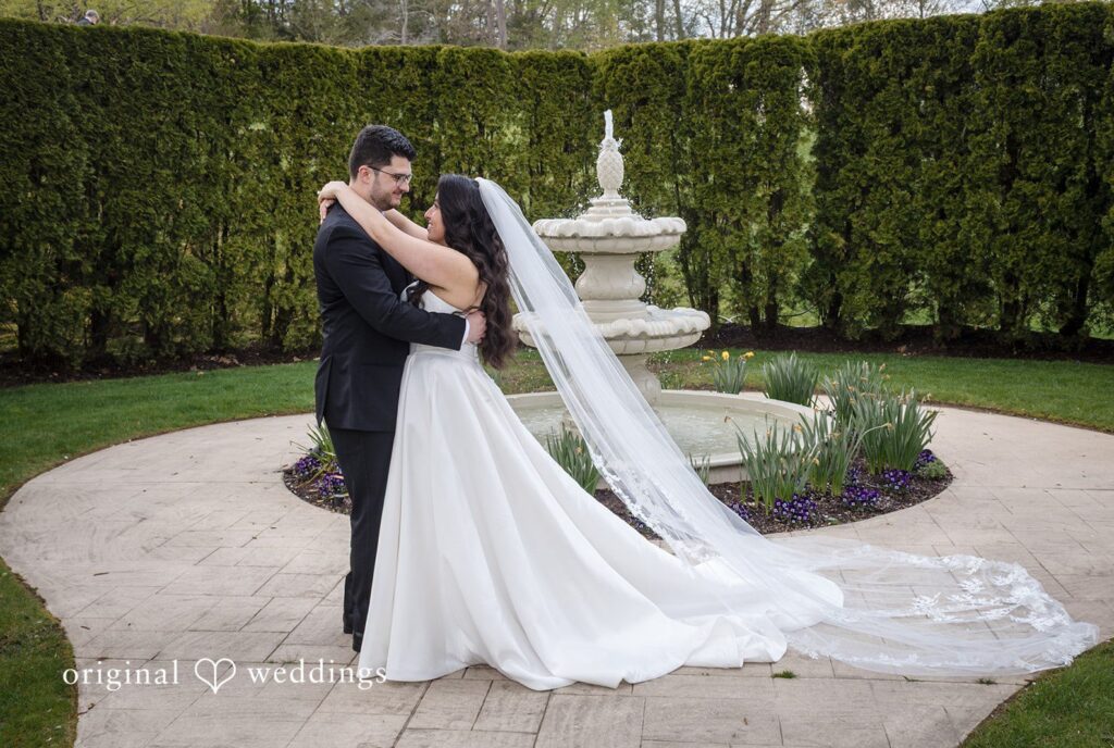 Newlywed couple sharing intimate moment at The Waterview captured by Hartford CT wedding photographers from Original Weddings